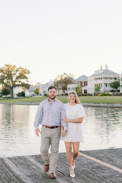 Couple smiling and looking at each other near the water