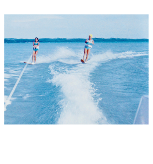 Skier being pulled by boat on Torch Lake