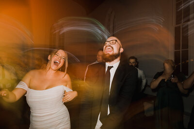 modern style fun dancing photo bride and groom