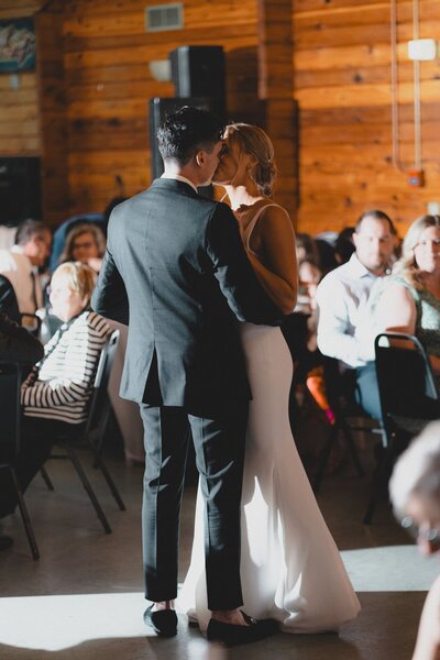 Wedding couple kissing during their first dance