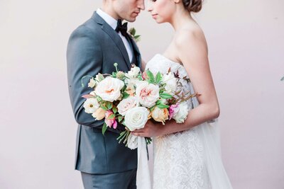 couple with bridal bouquet