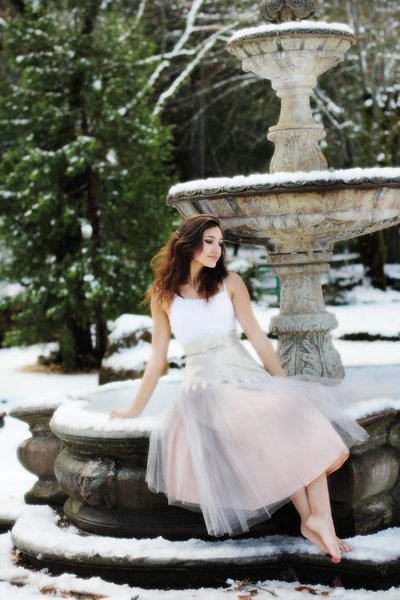 ballet dancer in snow on fountain