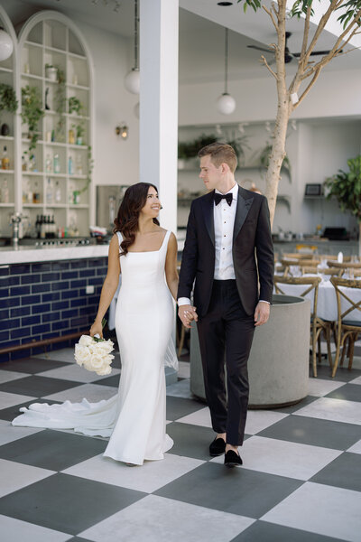 Bride and groom at Bixi Beer in Chicago, captured by Chicago wedding photographer Abe Fernandez in a candid, documentary style using digital and 35mm film