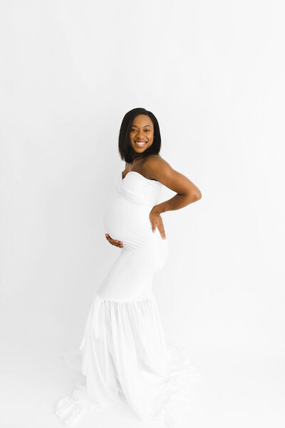 pregnant woman posing for boston maternity photographer