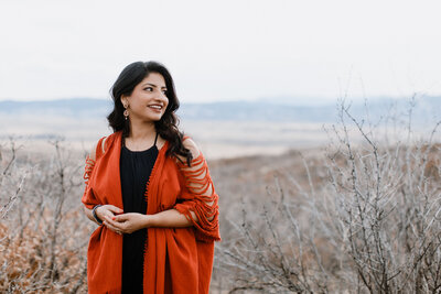 Mindfulness coach  Radhika. standing with mountains in background