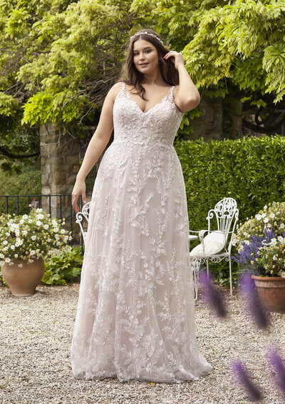 bride wearing a lacey aline wedding dress