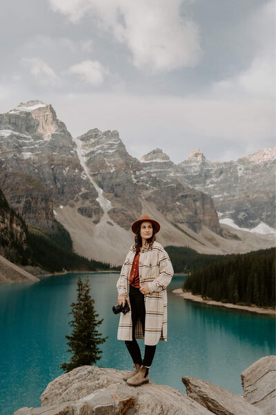 The BC photographer by a mountain lake, offering elopement wedding packages