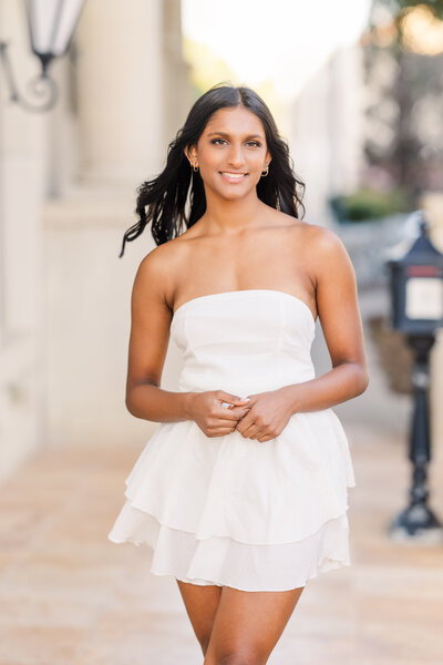 teen-girl-wearing-white-midi-sundress-walking-next-to-the-creek