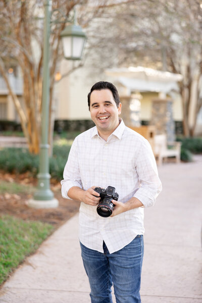 Guelph wedding photographer Chris hands in pocket smilling
