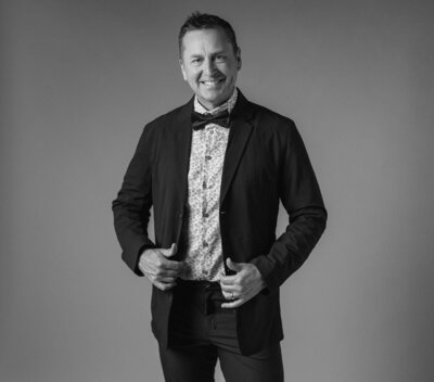 A portrait of a bride standing on steps of the Banff Springs Hotel in Banff National Park