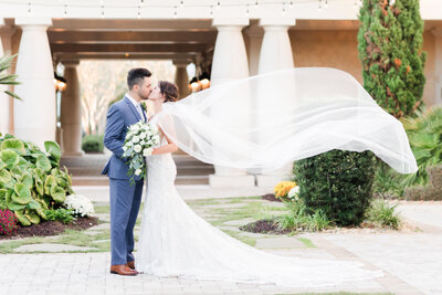 bride holding bouquet outdoors