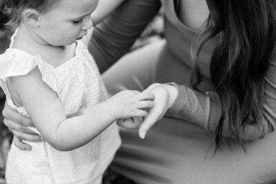 Child holding mother's hand