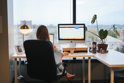 woman sitting at desk working