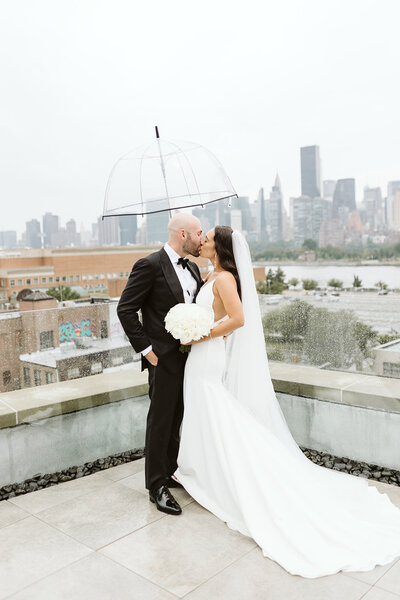 Bride and groom holding hands at their outdoor ceremony