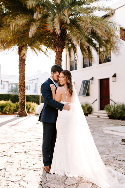 Florida elopement bride and groom under palm trees