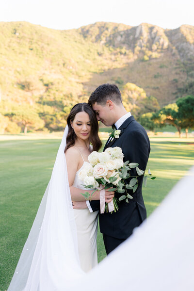 bride and groom snuggling