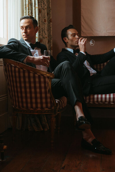 Will and Paul sitting and drinking champagne