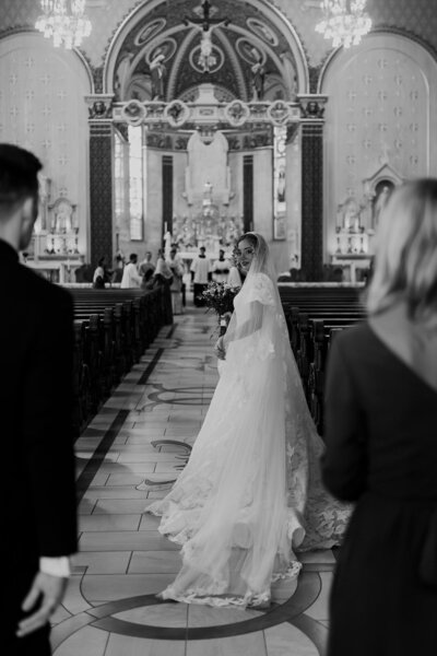 stunning bride looking back at her new husband