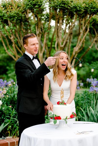 Bride looks surprised as groom points toward family at Charlottesville Clifton Inn wedding