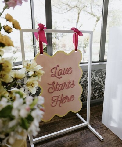 A white signage display frame with a fun welcome sign on display at a corporate event in Wanaka
