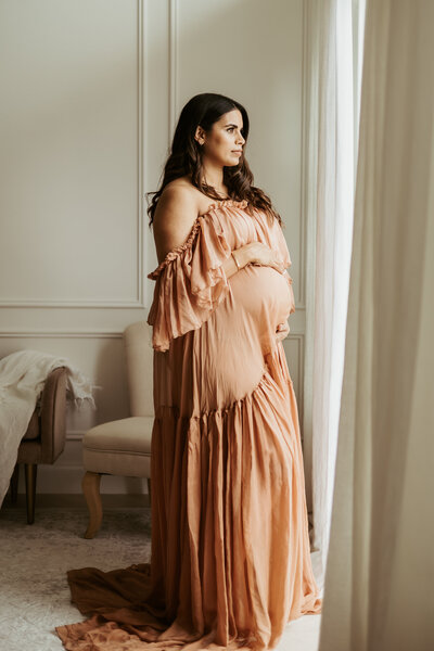 Beautiful pregnant woman in long dress for photoshoot in Sydney