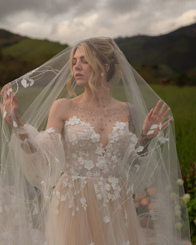 Bride portrait during wedding photos under wedding veil at Higuera Ranch in San Luis Obispo