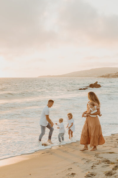 Family photoshoot at sunset in Newport Beach