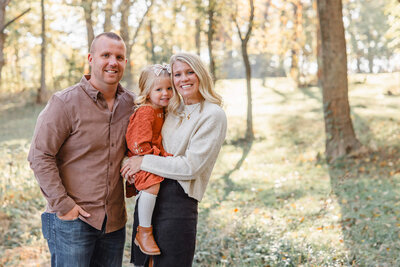 Family in woods posing for family photography session