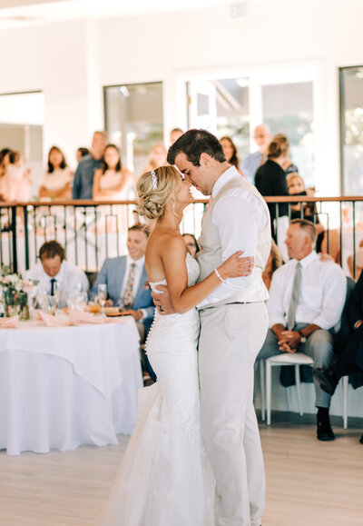 Bride and groom slow dancing on their wedding day in Denver Colorado at the Oaks venue