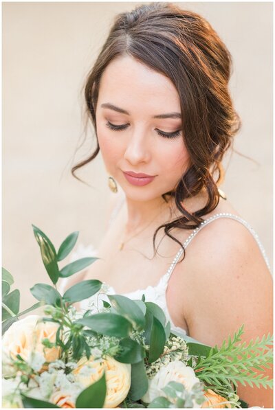 Bride holding bouquet at Rancho Robles Wedding Venue