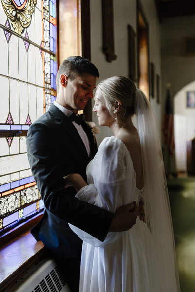 a groom smiling at his bride