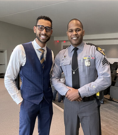 Divorce and family law attorney standing next to police officer