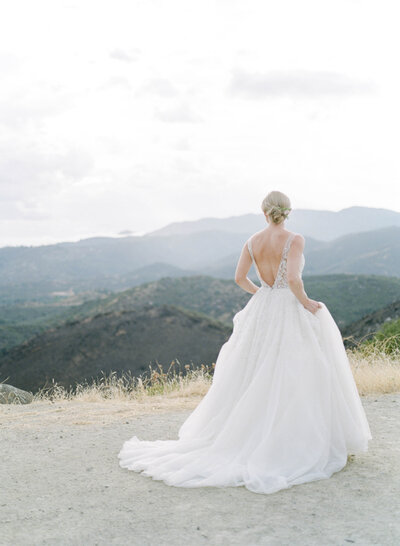 Bride walking along the California mountains