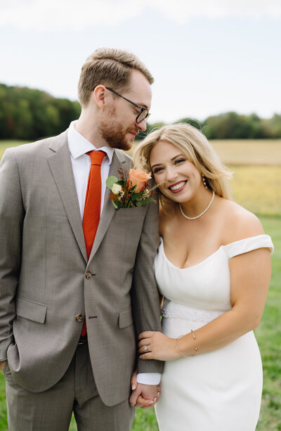 charlottesville wedding photographer captures bride and groom laughing under the brides veil at a northern virginia wedding venue