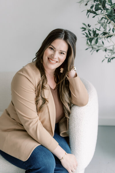 CJM founder Chloe Jackson sitting at her desk