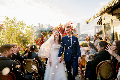 newlyweds walk down aisle