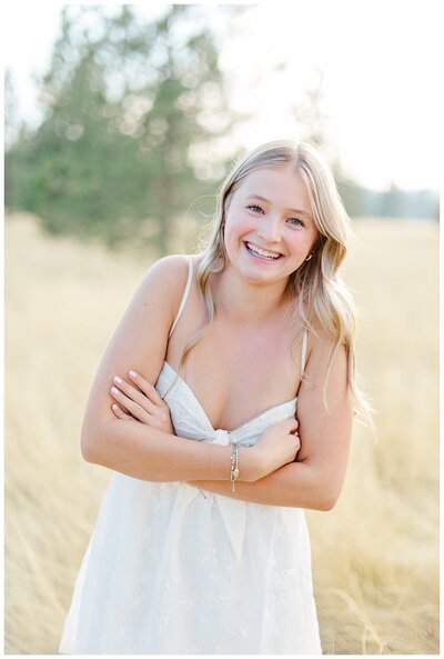 Missoula senior pictures of high school senior girl from Hellgate High School smiling in a field
