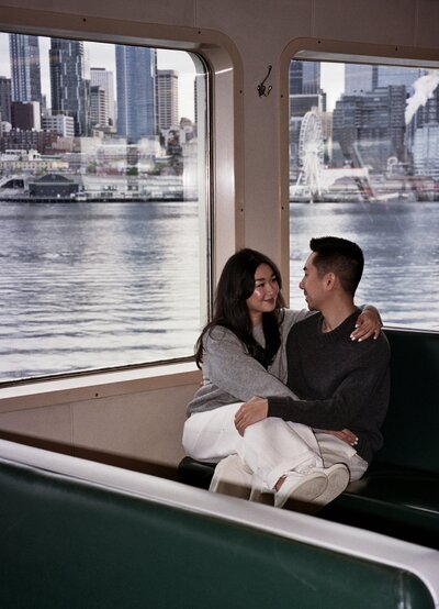 couple looking at each other on the seattle ferry boat 