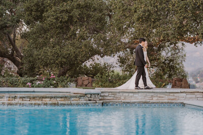 bride and groom poolside photo