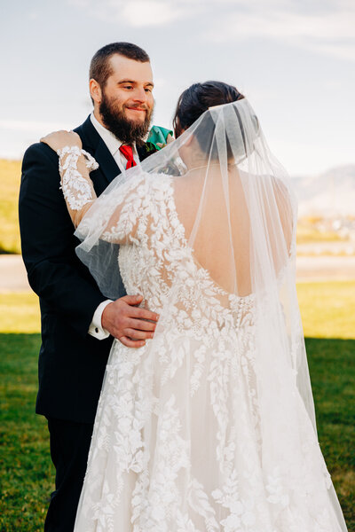 Bride and groom first look at Kwataqnuk Resort in Polson Montana
