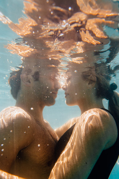 couple swimming underwater