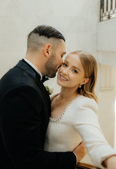A stunning couple's portraits - bride and groom getting married at San Francisco's city hall. Luxury hair and makeup by Yana Beauty Studio.