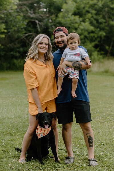 family smiling for camera