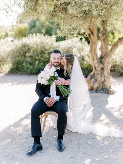  bride holding a bouquet of elegant florals during her whimsical wedding at allegretto resort in San Luis Obispo, California