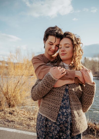 male female couple cuddling eyes closed relaxing