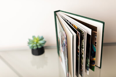 Custom emerald velvet wedding album cover with luxurious texture and personalized design.