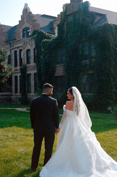 Couple embraces on their wedding day, surrounded by Tuscany’s serene beauty and charm.