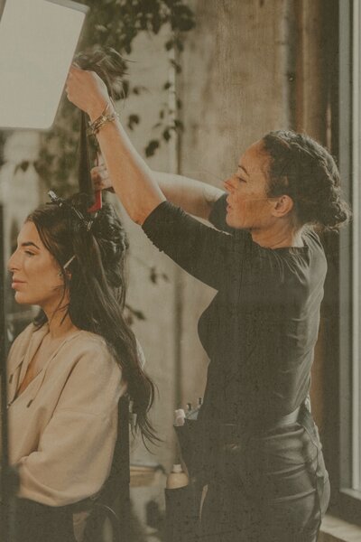 Ohio bridal hair stylist creating elegant wedding updo for Toledo bride