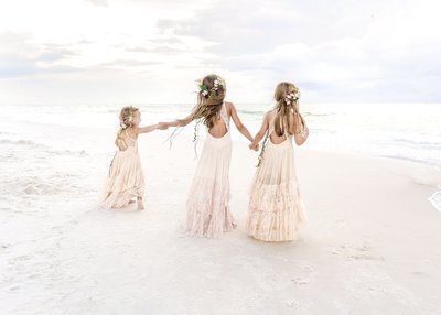 Whitney Sims Photography specializes in wedding, engagement, and family photography. She services Navarre Beach, Destin, and surrounding areas along Florida's gulf coast
