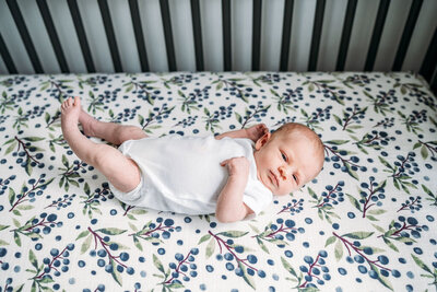 baby laying in her crib